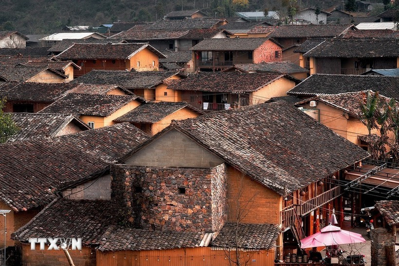 Houses feature rammed-earth walls and yin-yang roof tiles in Lo Lo Chai (Photo: VNA)