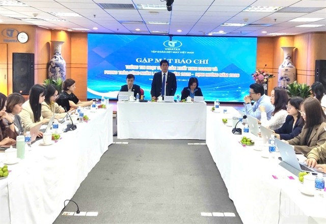 Vinatex holds a briefing in Hanoi on December 24. (Photo: VNA)