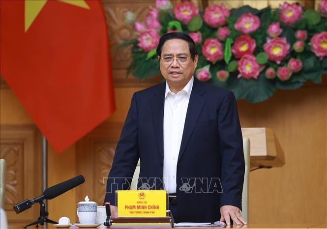 Prime Minister Pham Minh Chinh speaks at a meeting on accelerating Quang Trung Campaign. (Photo: VNA)