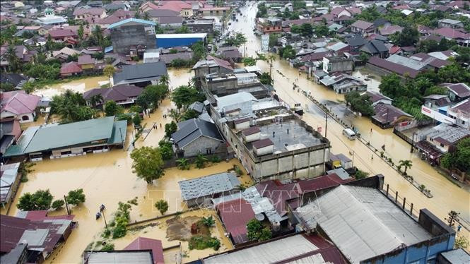 Flooded area in Aceh province, Indonesia on November 27. (Photo: Xinhua/VNA)