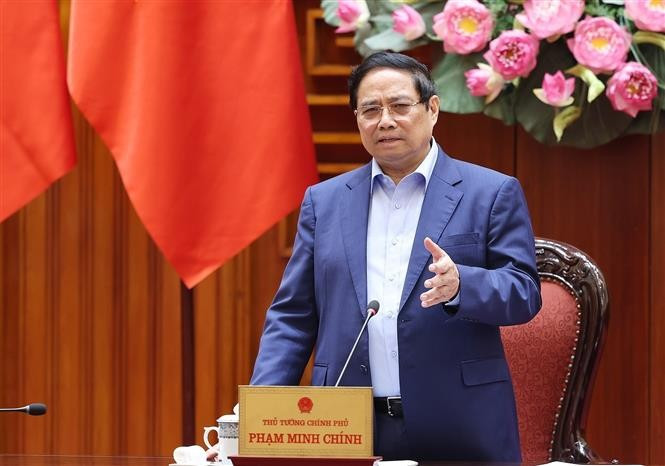 Prime Minister Pham Minh Chinh speaks at the meeting of the Government’s standing members on addressing the aftermath of natural disasters. (Photo: VNA)