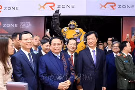 Prime Minister Pham Minh Chinh and delegates visit booths showcasing products at TechFest Vietnam 2025. Photo: VNA