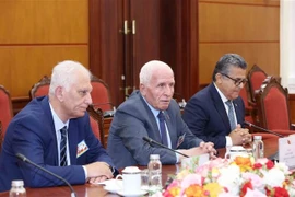 Secretary General of the Palestine Liberation Organisation (PLO) Azzam Najib Mustafa Al-Ahmad at the meeting. (Photo: VNA)