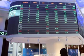 An investor monitors the developments of the stock market. Photo: VNA