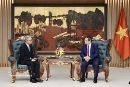 Prime Minister Pham Minh Chinh receives Indonesian Ambassador to Vietnam Adam Mulawarman Tugio in Hanoi on March 20. Photo: VNA