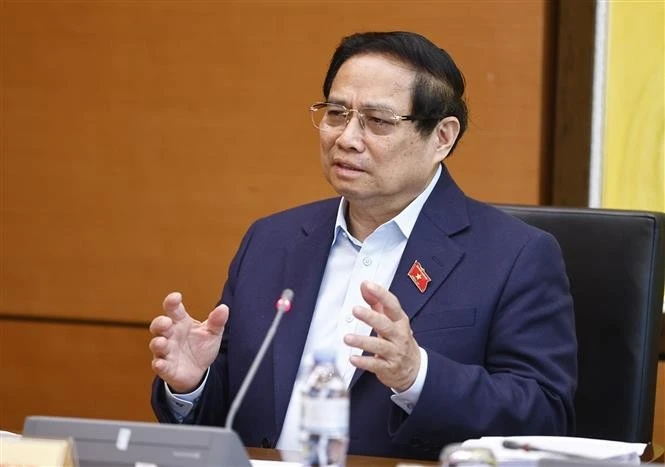 Prime Minister Pham Minh Chinh speaks in a group discussion as part of the National Assembly’s 9th extraordinary session on February 15 morning. (Photo: VNA)