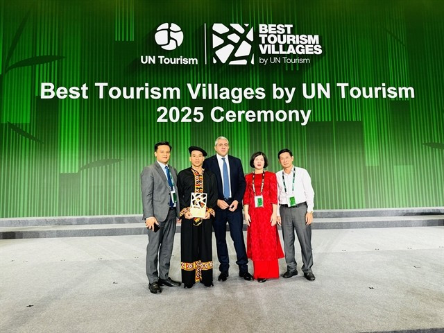 Representatives of Tuyen Quang province and organising committee pose for photo after Lô Lô Chải is honoured one of best tourism villages in 2025. — (Photos courtesy of Tuyen Quang province) 