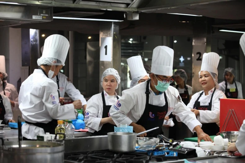 Participants in the "Amazing Thai to the World" project, initiated by Thacca, focus on enhancing the culinary skills of village cooks across Thailand. (Photo: Bangkok Post) 