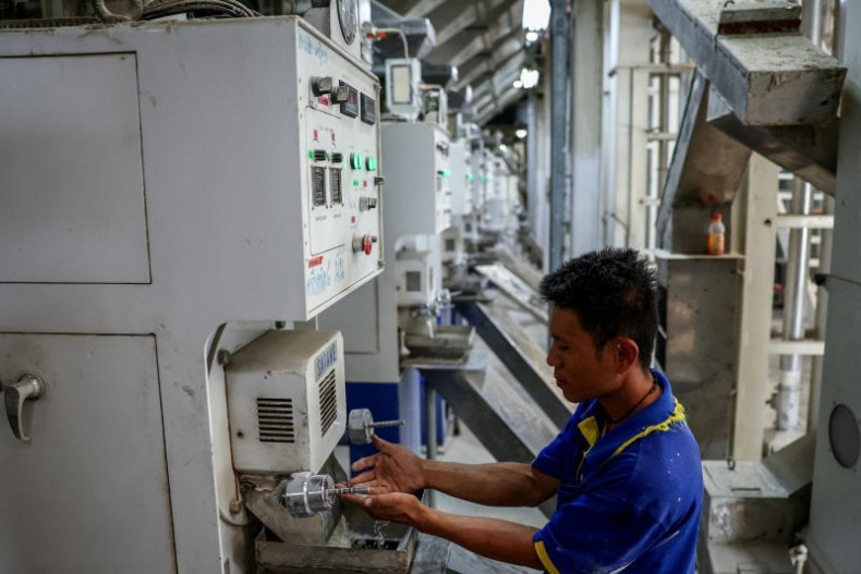 A man works at a rice mill in Nakhon Pathom province, Thailand, on April 18, 2025. (Photo: Bangkok Post) 