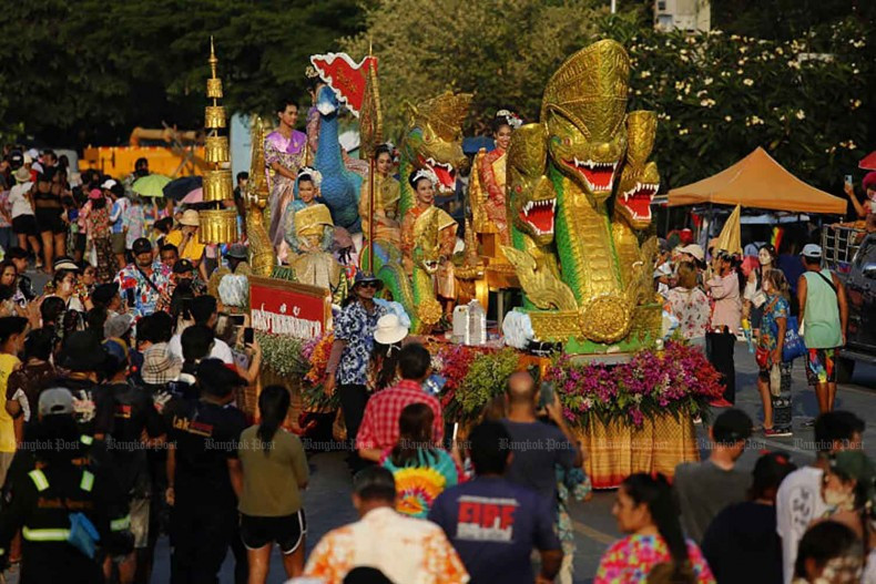People and performers accompany a float during a Songkran procession through downtown Phra Pradaeng district in Samut Prakan on 21 April 2024. The district typically celebrates Songkran festival a week later than the rest of the country. (Photo: Bangkoko Post) 