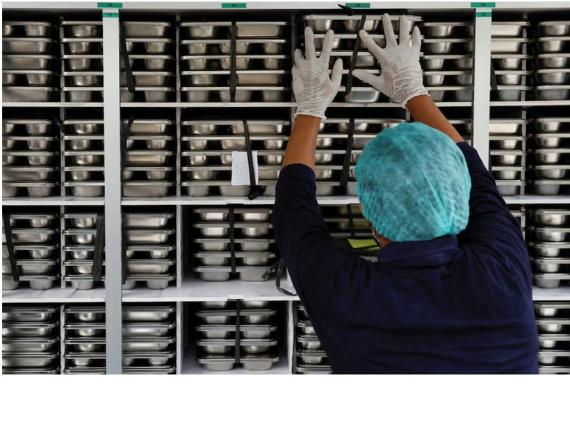 A staff member loads meal boxes onto a truck for free distribution to children and pregnant women, at a kitchen in Jakarta, Indonesia, January 6, 2025. (Photo: reuters.com)
