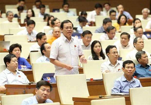 NA deputies vote on three laws, discuss two bills ảnh 1