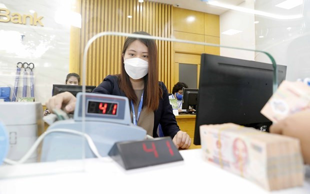 The State Bank of Vietnam sets the daily reference exchange rate for the US dollar at 23,093 VND/USD on June 15, up 4 VND from the previous day. (Photo: VNA) Reference exchange rate up 4 VND on June 15 ảnh 1