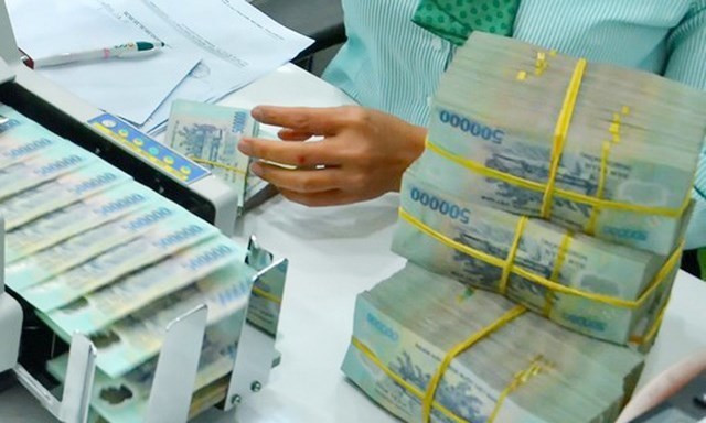 VAMC targets to settle 50 trillion VND of bad debts this year ảnh 1