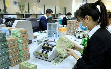 Bank credit outpaces deposits, lending rates ảnh 1