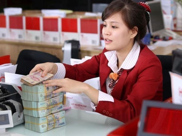 Reference exchange rate down 2 VND on December 21 ảnh 1