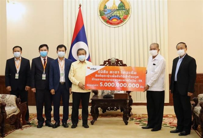 Vietnamese community in Laos joins hands in fighting COVID-19 ảnh 1