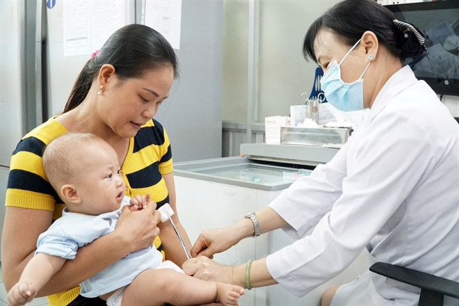 Vietnam on track towards paperless immunisation management system ảnh 1