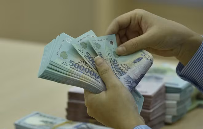 Reference exchange rate up 14 VND on February 19 ảnh 1
