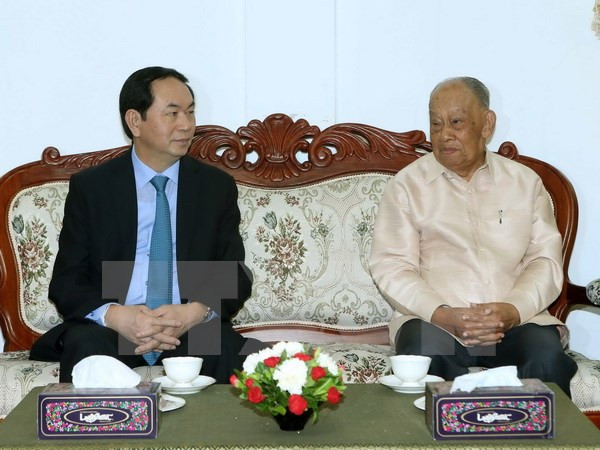 President concludes Lao visits, heads to Cambodia ảnh 1