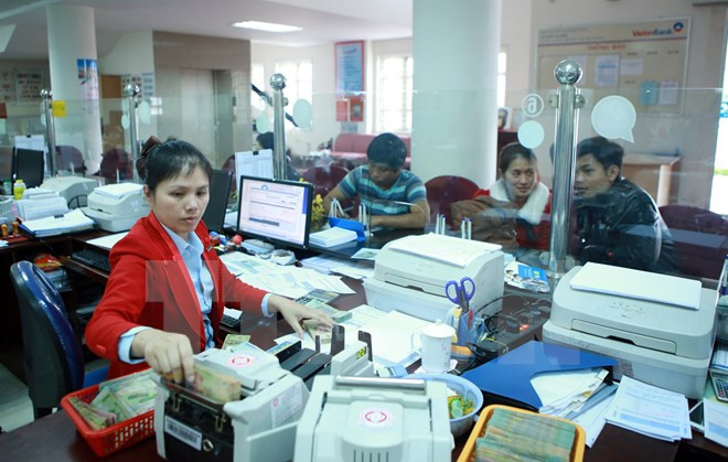 Mergers, acquisitions important move in restructuring banking system ảnh 1