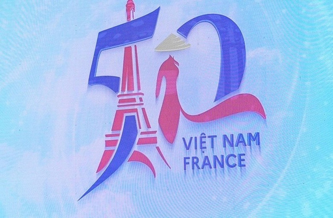 Photo exhibition marks 50 years of Vietnam-France diplomatic relations ảnh 1
