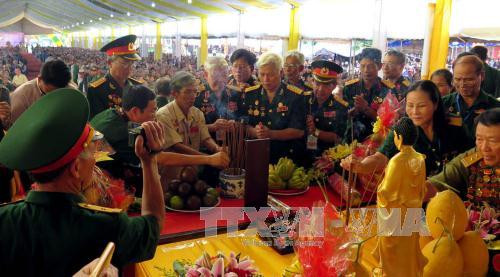 Exhibition highlights efforts to care for national contributors ảnh 1