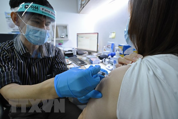 Singapore boasts world highest COVID-19 vaccination rate ảnh 1