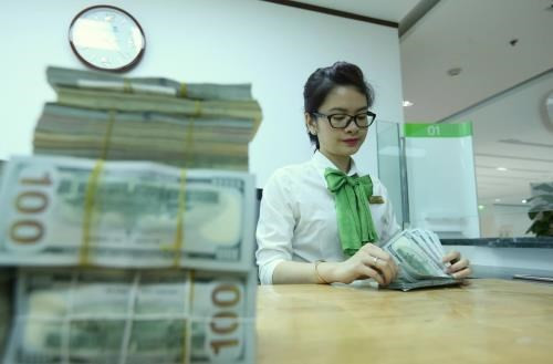 Reference exchange rate down 4 VND at week’s beginning ảnh 1 Reference exchange rate down 4 VND at week’s beginning ảnh 1