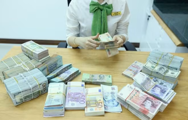 Reference exchange rate down 1 VND on November 26 ảnh 1