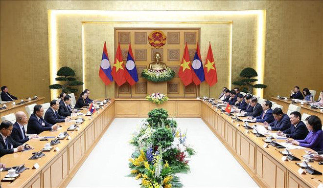 Vietnamese, Lao PMs join in working session in Hanoi ảnh 2 Vietnamese, Lao PMs join in working session in Hanoi ảnh 2