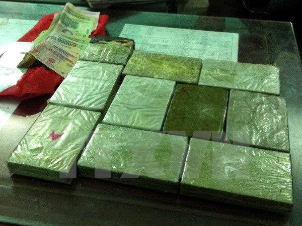 Anti-drug forces arrest two Lao traffickers, seize 11kg of heroin ảnh 1 Anti-drug forces arrest two Lao traffickers, seize 11kg of heroin ảnh 1