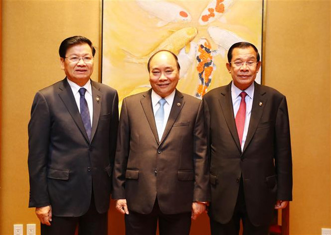 Vietnamese, Lao, Cambodian PMs review trilateral cooperation ảnh 1