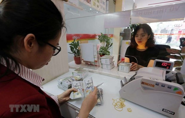 Reference exchange rate down 21 VND on March 17 ảnh 1 Reference exchange rate down 21 VND on March 17 ảnh 1