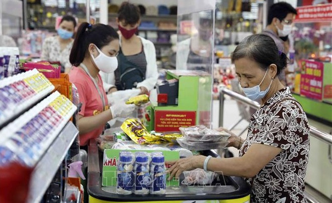 Promotions keep year-end consumer market busy ảnh 1