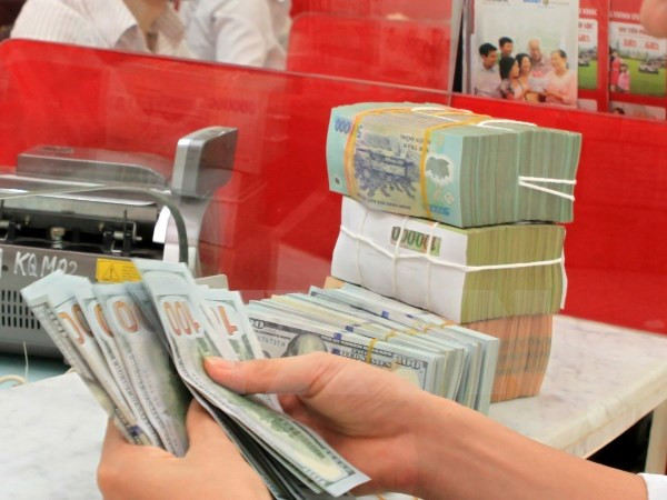 Central bank announces central rate for VND, USD ảnh 1