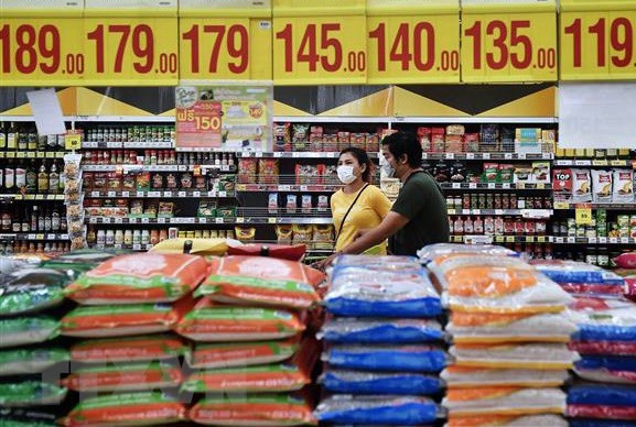 Philippines lowers import tariffs on rice, pork ảnh 1