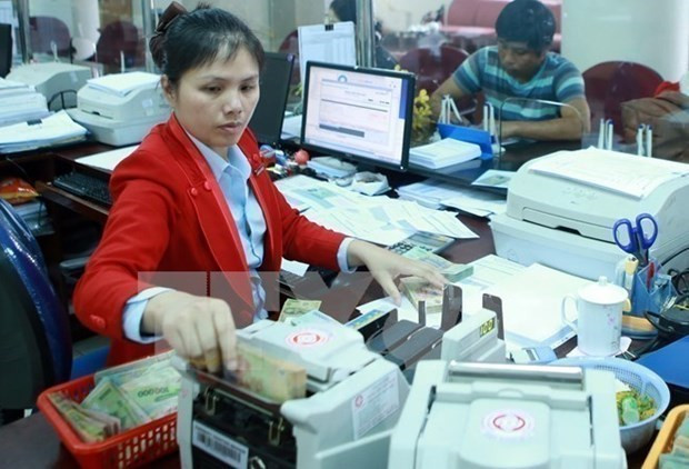 Reference exchange rate revised down 5 VND ảnh 1