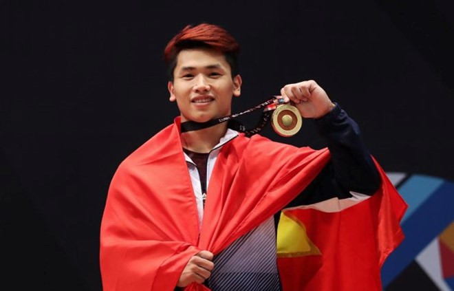 SEA Games 29: weightlifter Vinh wins gold, breaks 2 records ảnh 1 SEA Games 29: weightlifter Vinh wins gold, breaks 2 records ảnh 1