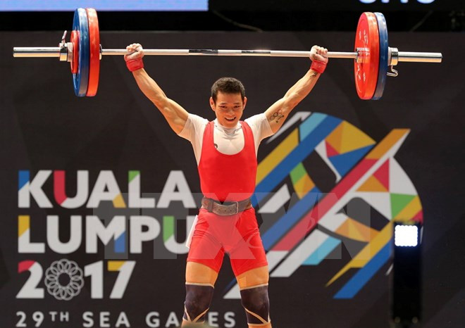 SEA Games 29: Thach Kim Tuan gets gold in weightlifting ảnh 1 SEA Games 29: Thach Kim Tuan gets gold in weightlifting ảnh 1