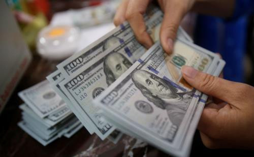 Reference exchange rate up 14 VND ảnh 1