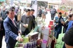 Leaders of Lam Dong province visit a booth at the wine, tea, coffee and specialties street programme. (Photo: VNA)