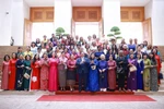 Prime Minister Pham Minh Chinh, his spouse, and Vietnamese and international female diplomats at the meeting in Hanoi on July 10, 2025. (Photo: VNA)
