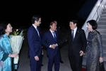 President Luong Cuong and his spouse are welcomed at John F. Kennedy International Airport on September 21 evening (local time). (Photo: VNA)
