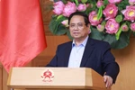 PM Pham Minh Chinh addresses the conference reviewing the one-month operation of the two-tier local government model on July 28. (Photo: VNA)