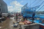 Seafood from a fishing vessel is unloaded at the Binh Chau fishing port in HCM City. (Photo: VNA)