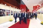 Permanent member of the Party Central Committee’s Secretariat Tran Cam Tu (front, centre) and other officials examine an exhibition of publications serving the 14th National Party Congress on January 13. (Photo: VNA)