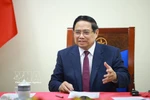 Vietnamese Prime Minister Pham Minh Chinh at the phone talks with his Algerian counterpart Sifi Ghrieb on March 18 (Photo: VNA)