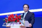 Prime Minister Pham Minh Chinh speaks at the conference in HCM City on August 2 on the implementation of the National Assembly’s Resolution No. 222/2025/QH15 on the IFC. (Photo: VNA)