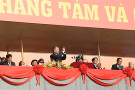 Party General Secretary To Lam (standing) and delegates attend the ceremony. (Photo: VNA)